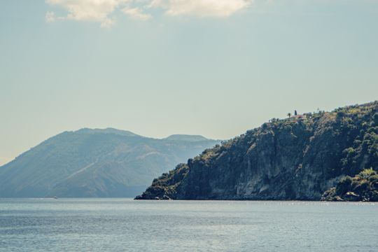 Layered island headlands seen across the water