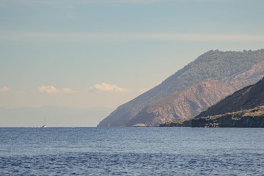 A volcanic headland descending towards the sea